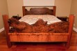 Beautiful custom-made redwood bed. Cats paw on lower-footboard. Posts are quarter sawn clear all heart vertical grain. Main foot and head boards are lacy burl. End tables are lacy burl with vertical grain legs. We are your custom redwood furniture specialists!