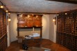 Custom made redwood wine racks in wine cellar for 3500 bottles.